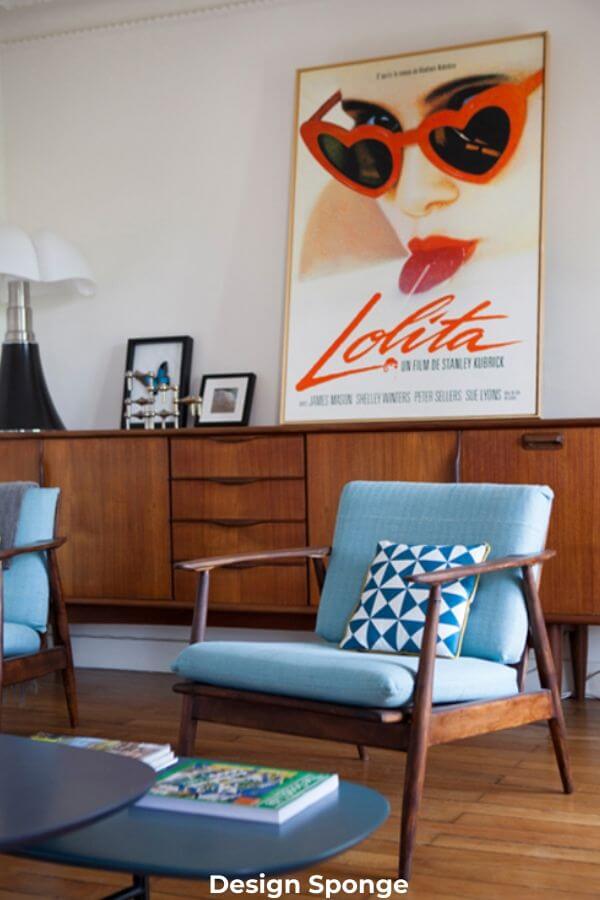 midcentury modern blue chair and vintage art in modern retro living room